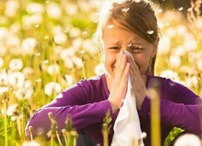 Allergy Season - Girl with tissue wipping her nose