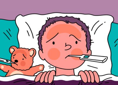 Child in bed with a thermometer in is mouth